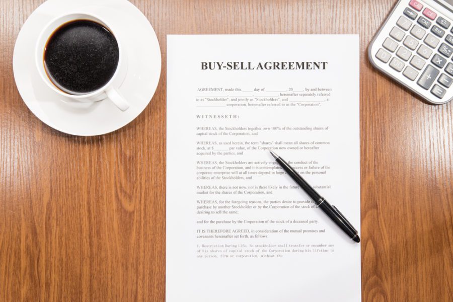 Buy Sell Agreement and a black color pen